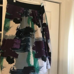 Silky knee-length skirt by Triste